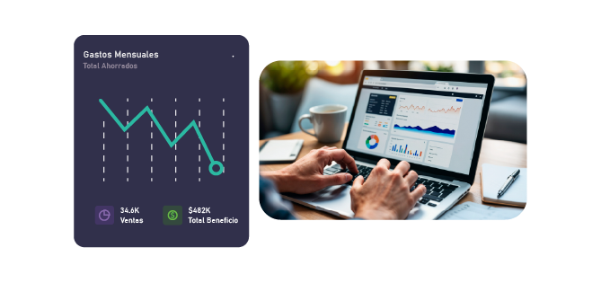 Gráfico de línea descendente mostrada como componente de dashboard junto a unas manos sobre un teclado de portátil revisando un informe financiero con tablas y gráficos en pantalla.